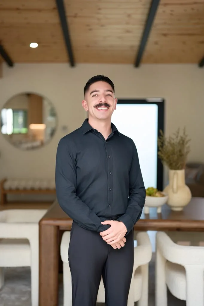 Portrait of Quinton Sanchez, San Diego real estate agent, in a black shirt